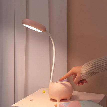 Różowa lampka na biurko świnka